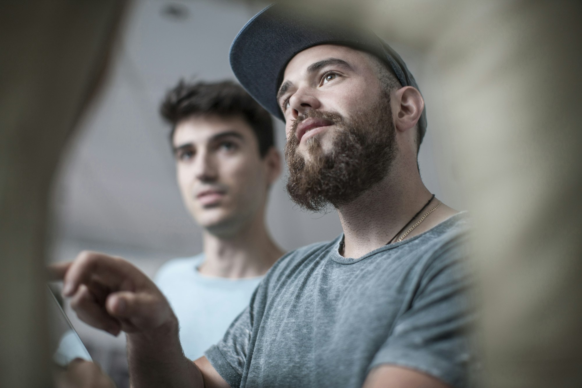 Two young men at office reception